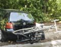 Using the foot pedal below the licence plate, the carrier and racer can be folded far back and the tailgate opened without collision