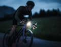 Road bike with a battery-powered headlight on the handlebars