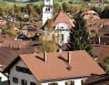 Hittisau (km 46.8). The Ammergau Alps tower behind Nesselwang (Tour 2)