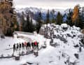 Panorama. Group photo with drone - below, the group enjoys the free ride on the Rossfeld road