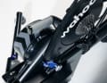 The trainer sits on a kind of curved track or rails.