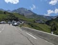 Wherever possible, cars and campers are parked at the side of the road waiting for the Tour de France Femmes