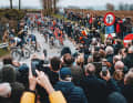 Spectators have to find a place in the limited space between the fields and pavement