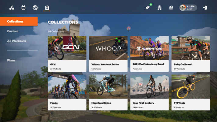 Auf dem neuen Zwift Startbildschirm hat man über die Tabs oben Links schnellen Zugriff auf Events, Group Rides und Workouts. Oben rechts kommt man einfach zu gekoppelten Geräten oder in den Drop Shop. | Hersteller