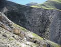 Ziemlich karg präsentiert sich die Landschaft oberhalb des Ofenpass’. Der Trail selbst ist ein Mix aus Flow und kurzen, technisch anspruchsvollen Stücken in grobem Geröll.