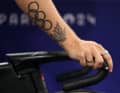 Auch die kanadische Bahnradfahrerin Lauriane Genest trägt die olympischen Ringe mit sich